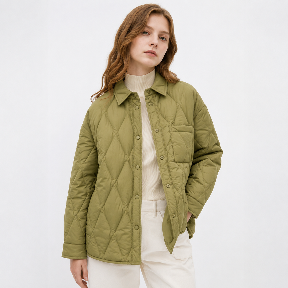 Woman wearing a olive green women's diamond-quilted shirt jacket in a clean studio upper-body front view