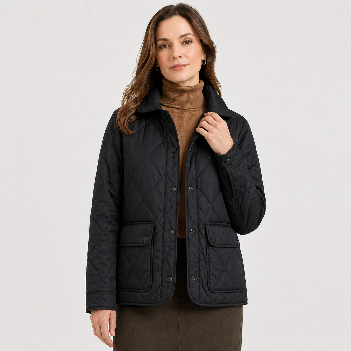 Model wearing a black women's diamond-quilted lightweight jacket in a clean upper-body studio front view