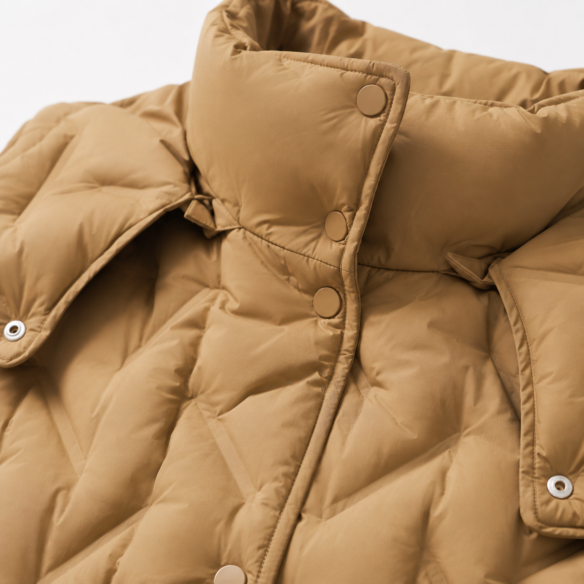 Close-up of high collar, snap placket and quilted front on the camel women's hooded puffer jacket